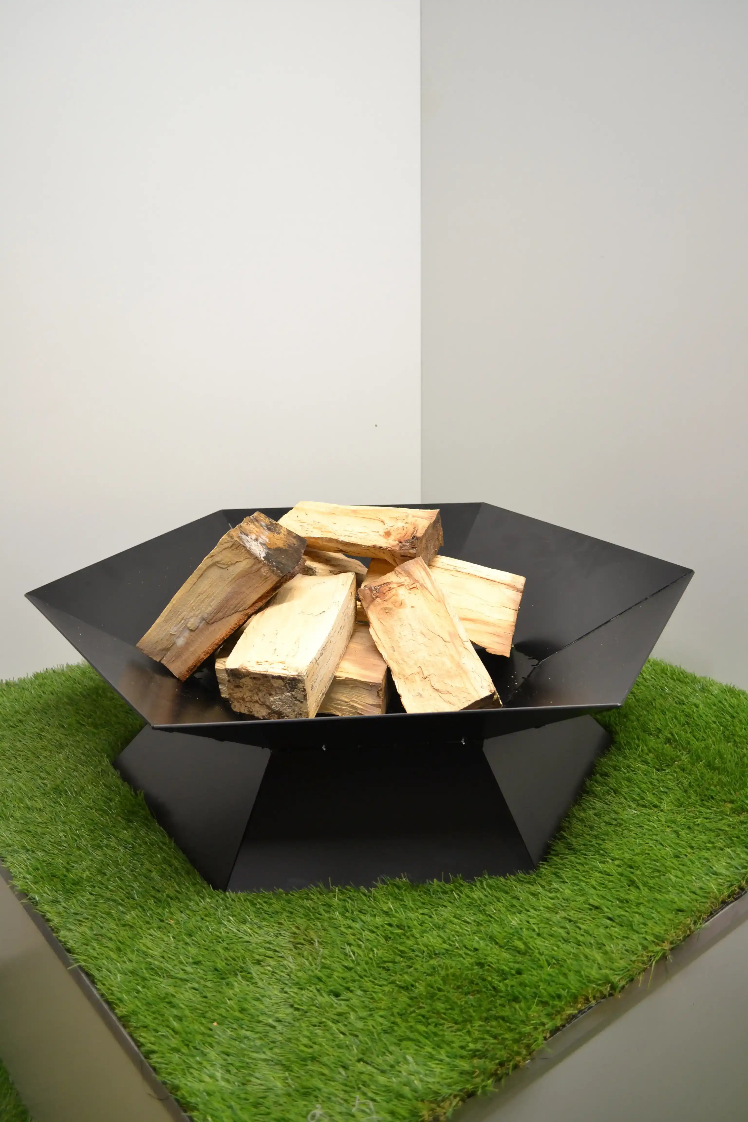 Hexagonal Fabricated Steel Fire Pit manufactured by Techrail Low-profile outdoor fire pit fabricated from folded hexagonal steel panels.
