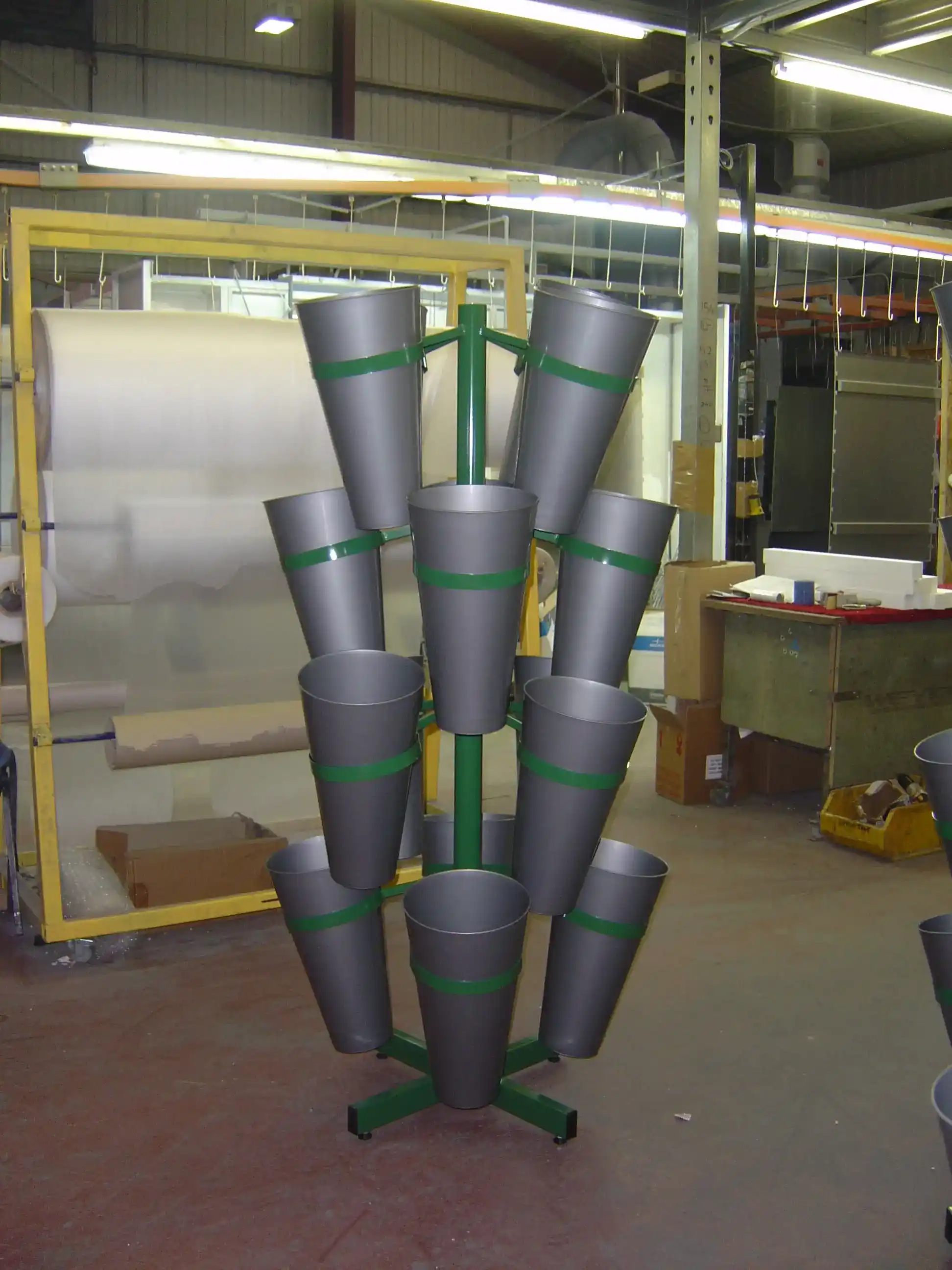Freestanding Metal Flower Display Stand manufactured by Techrail Powder-coated retail flower stand with multiple angled bucket holders.
